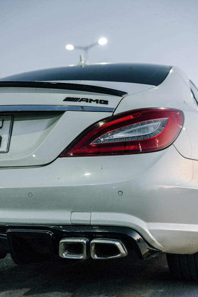 Rear view of a sleek white Mercedes-Benz AMG parked in Tripoli.