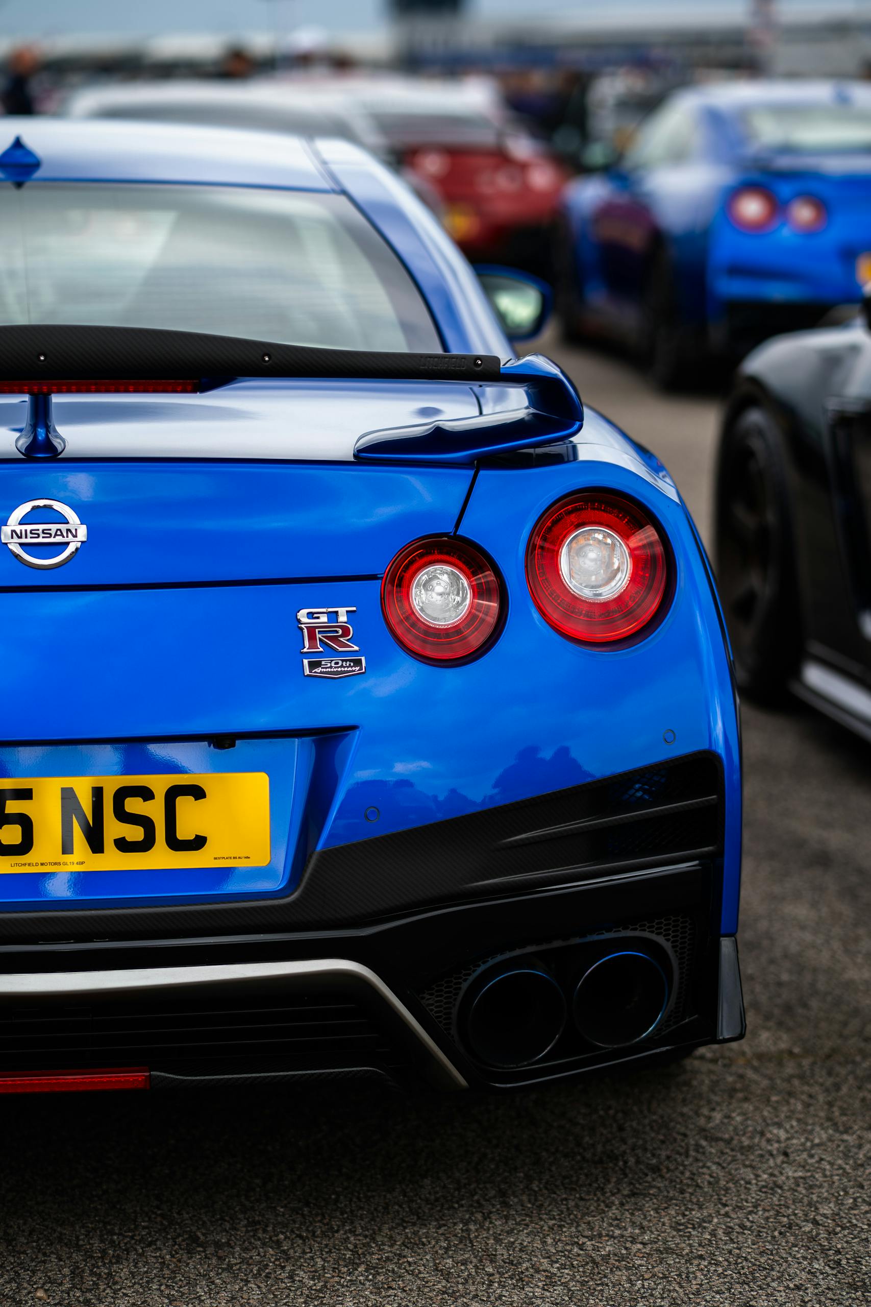Vibrant blue Nissan GT-R showcased at the Japfest 2025 car show, featuring sleek design and powerful aesthetics.